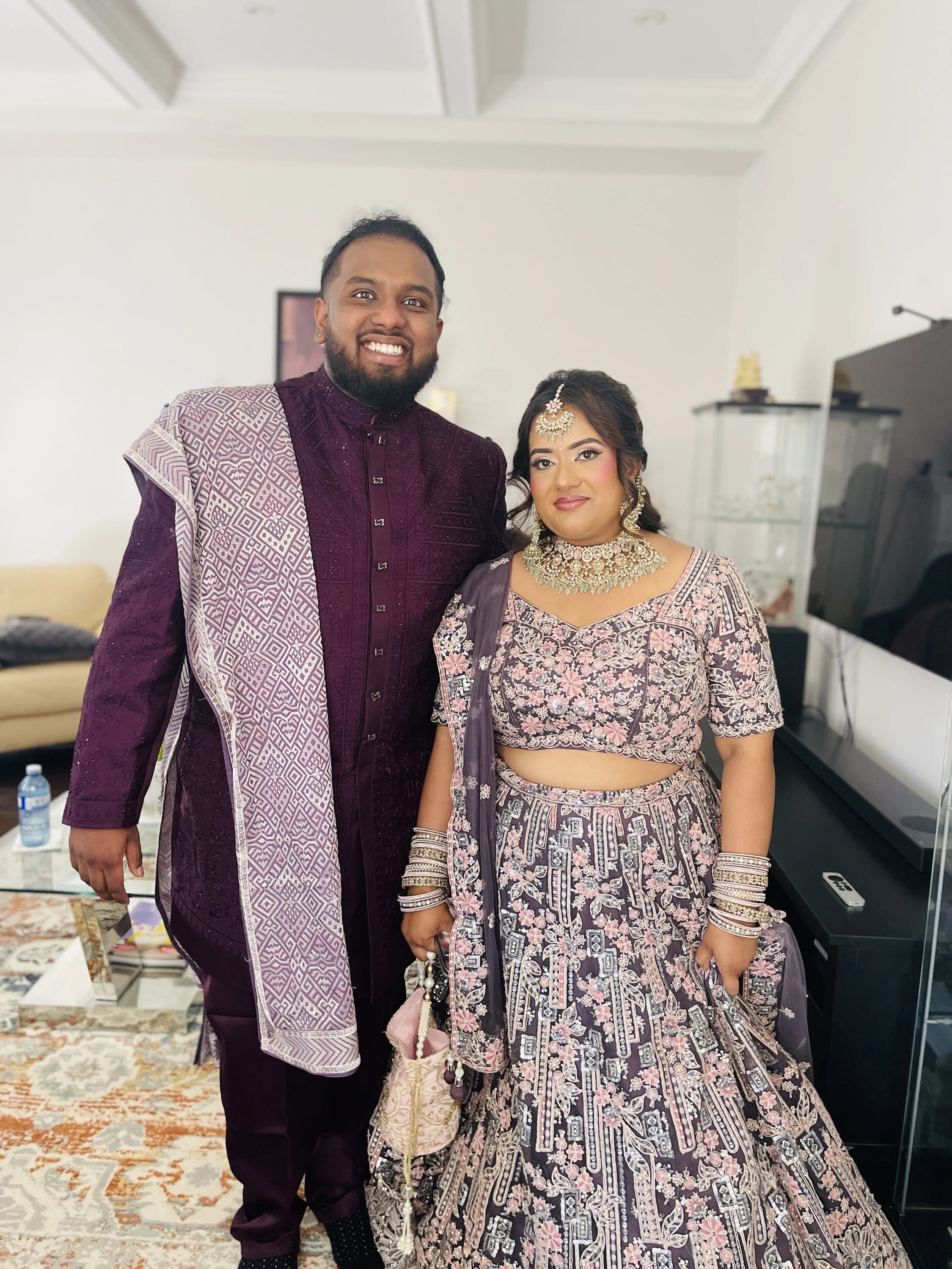 Arnab and Sudipra wedding attire indoors